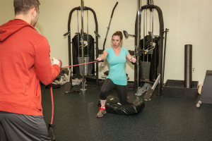 personal trainer at Shape Up Fitness & Wellness Consulting helping a client