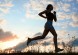 Silhouette woman run under blue sky with clouds